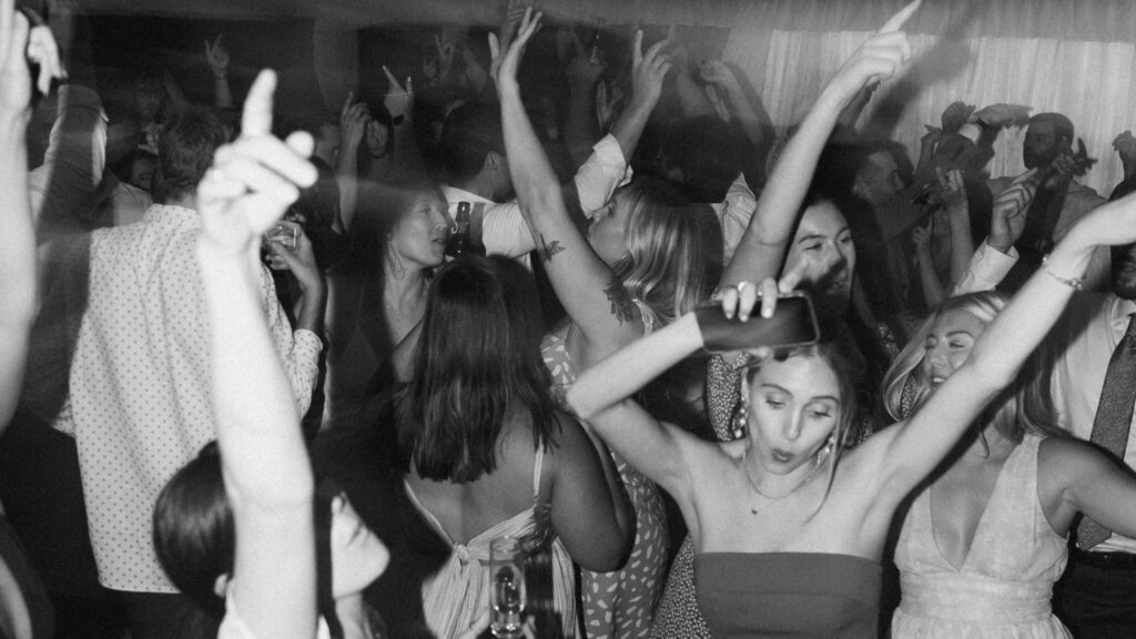 Editorial reception photo with dramatic lighting and candid movement