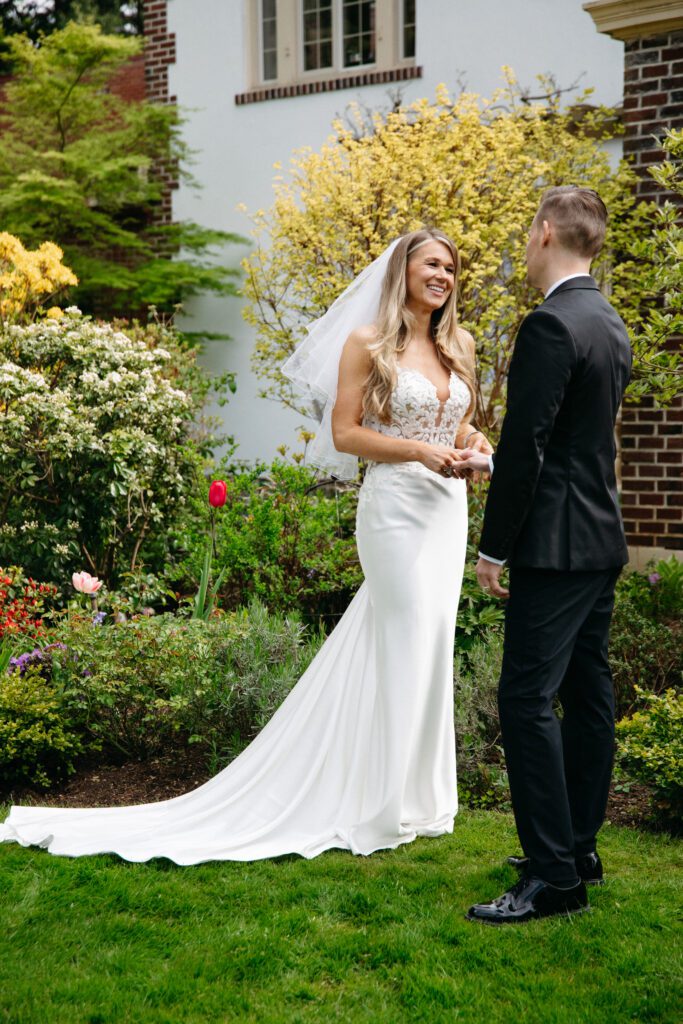 Candid emotional portrait of bride and groom laughing together